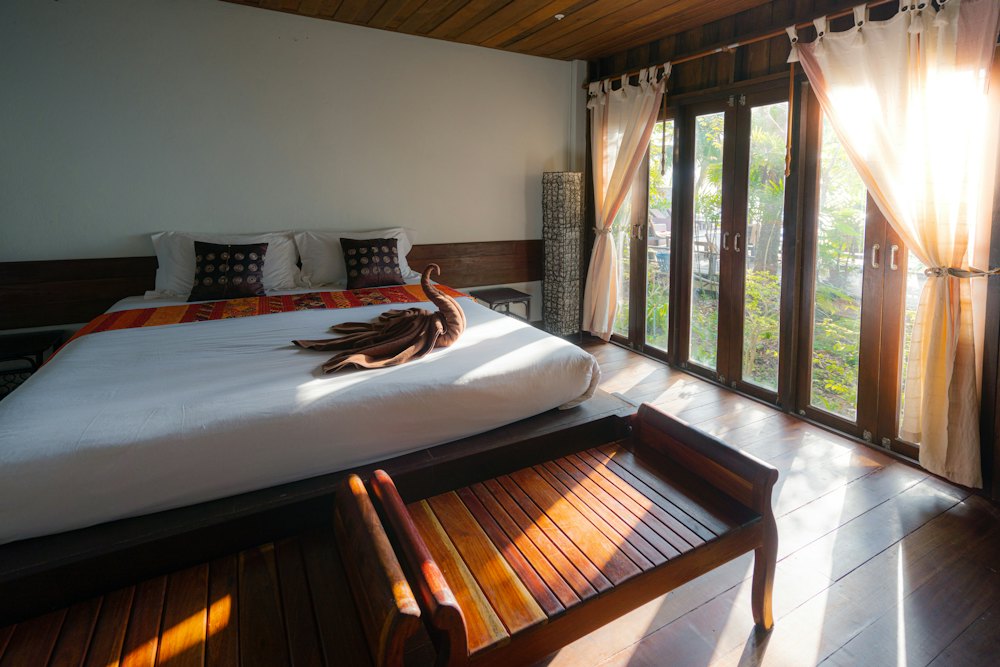 Sample photo: a bright guest room with a large bed